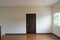 Abstract brown door close in dark light. sad and alone emotion in empty house. vacancy property white wall background