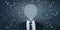 Abstract businessman with brain head on chalkboard wall background with arrows and thought icons sketch. Solution, direction,