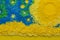 Abstract cake topping sprinkle background with conceptual picture consisting of yellow, blue and green sprinkles close up - top