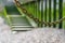 Abstract chain hanging in front of steps along the Thames at low tide, Central London