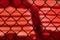 Abstract chain link fence with red