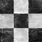 Abstract checkered pattern painted with acrylic or oil paints on canvas in black and white colors