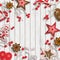 Abstract christmas background, dry branches with red berries and small scandinavian styled decorations