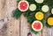 Abstract Christmas tree food background with grapefruit, mandarin, lemon, lime, kumquat