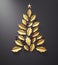 Abstract christmas tree made of golden leaves