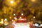 Abstract circular bokeh blurry yellow light on the road with blur white car at night