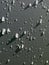 Abstract close-up view of water and hail on gray background