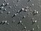 Abstract close-up view of water and hail on gray background