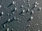 Abstract close-up view of water and hail on gray background