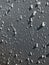Abstract close-up view of water and hail on gray background