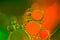 Abstract cluster of green and orange water bubbles