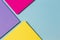 Abstract color papers geometry flat lay composition banner background with purple, yellow, magenta and blue color tones