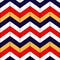 Abstract colorful geometric chevron seamless pattern in blue red yellow and white, vector