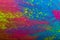 Abstract colorful Happy Holi background. Color vibrant powder on wood. Dust colored splash texture. Flat lay holi paint