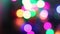 Abstract colorful holiday beautiful blurred bokeh blinking neon lights on dark background