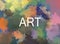 Abstract colorful paint splotches with the word `art` in center.