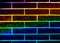 Abstract and colorful wall with black bricks