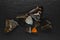 Abstract composition of dried butterflies placed on black stone background