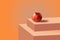 Abstract composition with pumpkin on podium