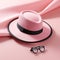 An abstract concept featuring a pink hat and eyeglasses with a soft overflow of shades and tones