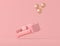 Abstract conceptual idea of pink sofa is floating up by gold balloons isolated on pink background, minimal style. 3D rendering