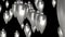 Abstract cone-shaped silver Christmas decorations in the rays of moonlight move in endless space. 3D. 4K. Isolated black