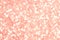 Abstract coral background. Shiny glitter bokeh in coral colors