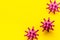 Abstract Corona virus Covid-19 strain model on yellow background top-down frame copy space