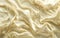 Abstract cream background with a milky wave and swirl texture. Flowing milk gradient splash pattern with a satiny