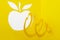 Abstract cutout yellow paper apple