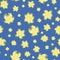 Abstract daffodil flowers vector seamless pattern background. Bright yellow mix of flower heads on blue backdrop. Hand