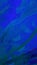 Abstract dark blue background of brush strokes with acrylic paint. Vertical liquid divorces