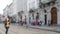 Abstract defocused blurred background of many people on street square