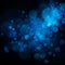 Abstract defocused circular blue bokeh on dark background. EPS 10