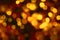 Abstract defocused circular golden luxury gold glitter bokeh lights background