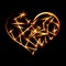 Abstract design-fiery heart shape on black background.