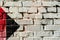 Abstract detail of brick wall with fragment of colorful graffiti. Urban Art closeup. With place for your text, for