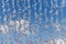 Abstract detail of water falling from a fountain against a blue sky