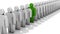 Abstract difference and individuality, uniqueness and leadership business concept, single green 3D people figure in row of white f