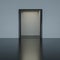 abstract door in dark room with moderate warm low key lighting and corridor modern architecture 3d render illustration