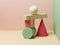 Abstract equilibrium still life installation of colorful primitive geometric shapes. 3d