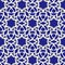 Abstract festive Christmas snowflake pattern on blue background