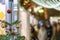 Abstract festive lights and Christmas shopping, crowd of people. Christmas tree with decorations, blurred background