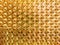 An abstract flat industrial close-up background of shiny brass metal threaded hexagonal fitting parts