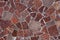 abstract flat texture and background of red granite pieces mosaic