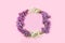 Abstract Floral composition flat lay, background, minimum holiday concept, banner of spring. Creative modern wreath with lilacs.