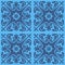 Abstract floral seamless pattern on blue background, patchwork textile design