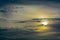 The abstract formation and texture of the clouds over and around the sun. Above the Gulf of Mexico in florida