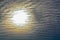 The abstract formation and texture of the clouds over and around the sun. Above the Gulf of Mexico in florida