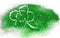 Abstract four-leaf clover of green glitter sparkle on white